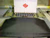 front view of portfolio on machine using fastframes and spray adhesive